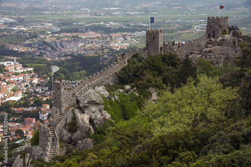 The battlements of the wall of Moorish castle and Sintra city below