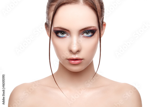 Beautiful spa model girl with perfect fresh clean skin, wet effect on her face and body, high fashion and beauty portrait , creative makeup theme , strobing or highlighting makeup, look at the camera.