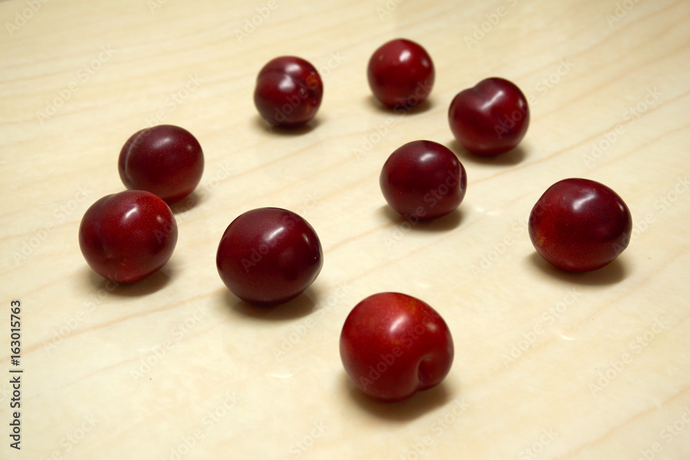 there are many red plums. there are many red plums.