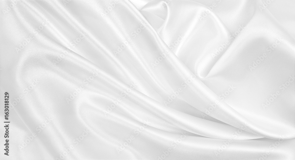 Smooth elegant white silk or satin luxury cloth texture as wedding background. Luxurious background design Smooth elegant white silk or satin luxury cloth texture as wedding background. Luxurious background design