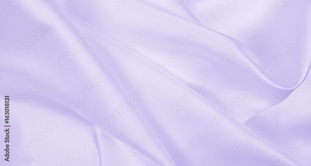 Obraz premium Smooth elegant lilac silk or satin texture as wedding background. Luxurious background design