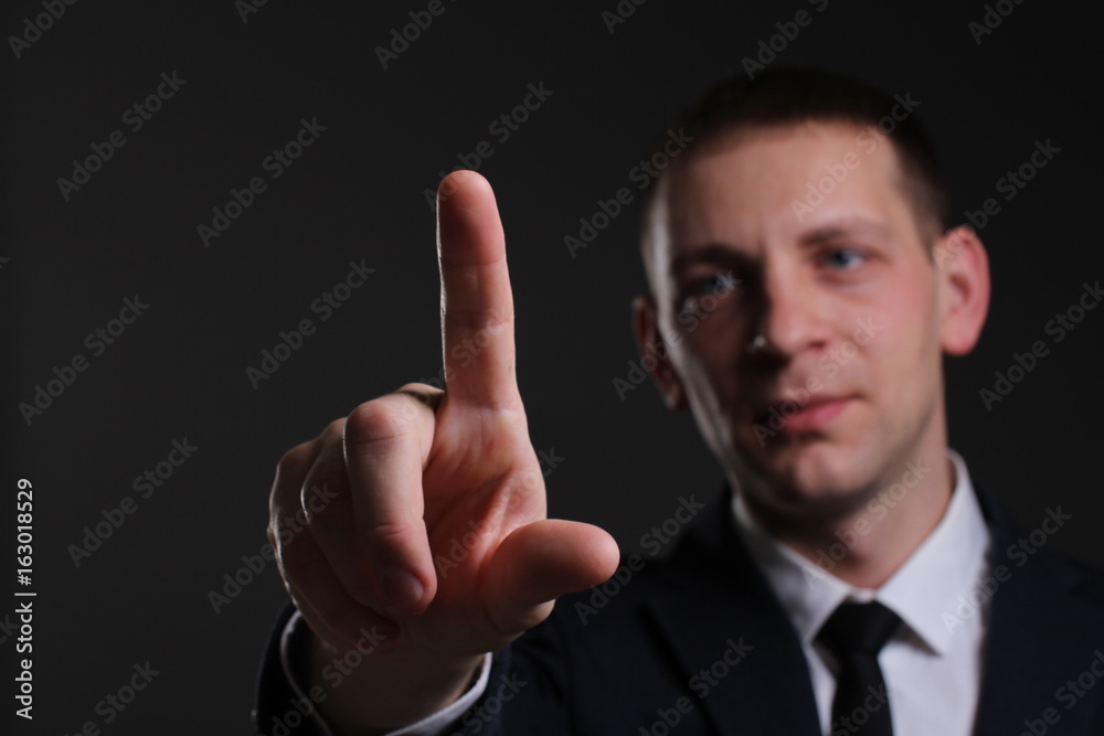 Portrait of a young businessman in a strict suit Portrait of a young businessman in a strict suit