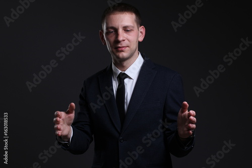 Portrait of a young businessman in a strict suit