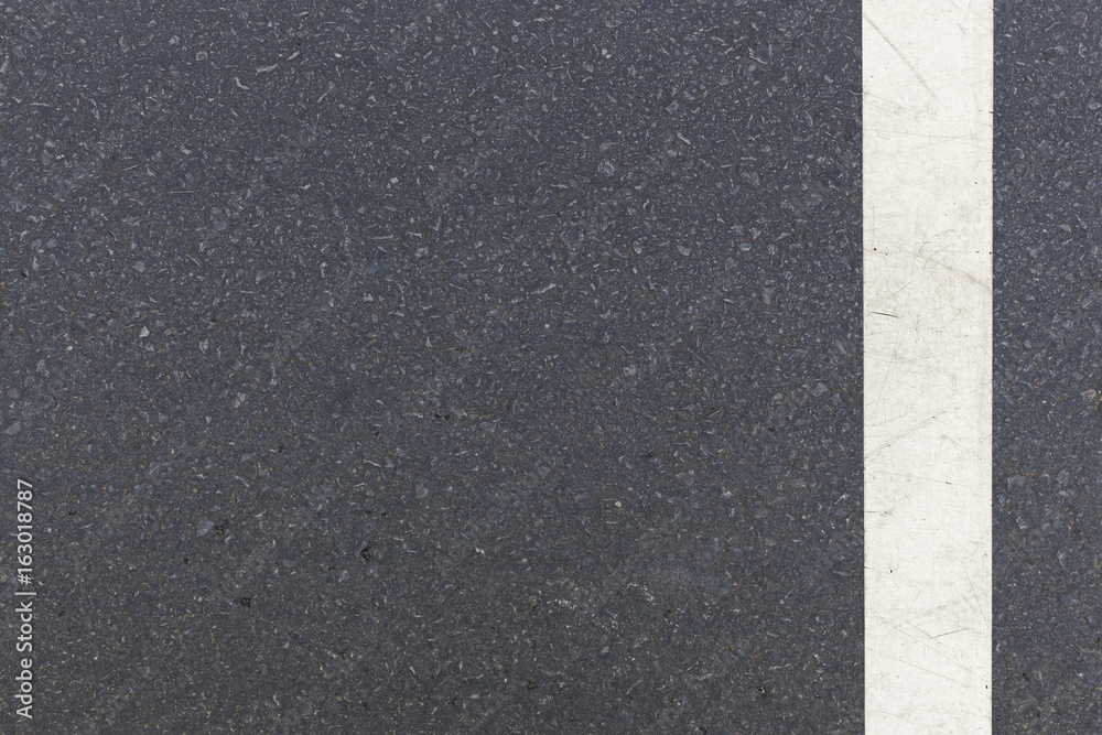 Fototapeta premium close-up white line on road, top view