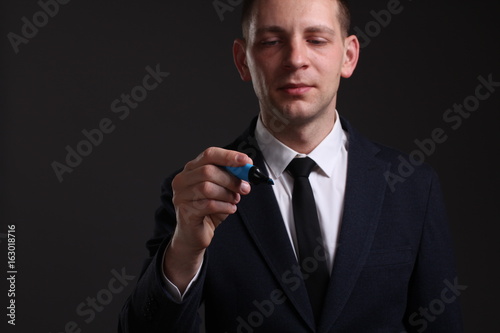 Portrait of a young businessman in a strict suit