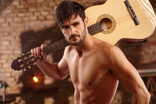 Sexy man with guitar