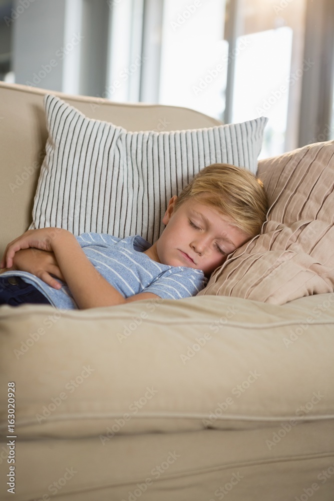 Boy sleeping on sofa in the living room Boy sleeping on sofa in the living room