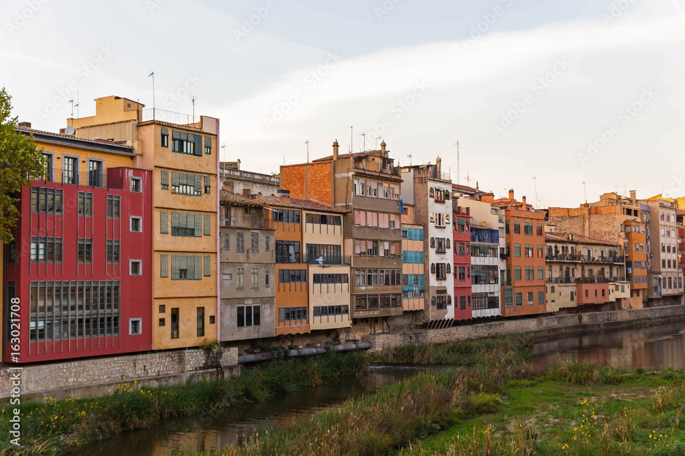 Facade of the houses on the bank of river Onyar. Girona, Catalonia, Spain.
