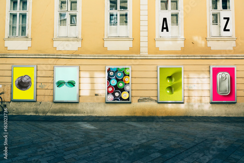 billboards with photographs at city street