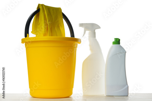 Cleaners, sponges, rags and rubber gloves on a white background