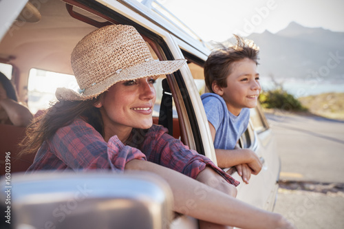 Mother And Children Relaxing In Car During Road Trip photo