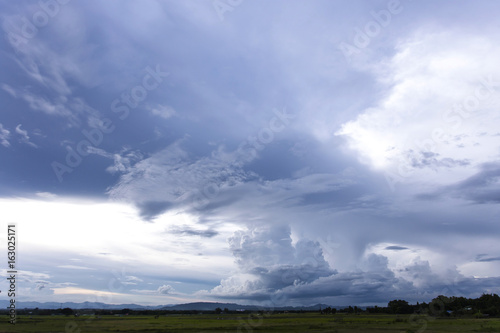 Fototapeta Naklejka Na Ścianę i Meble -  Grey solid cloud is rain over the farm