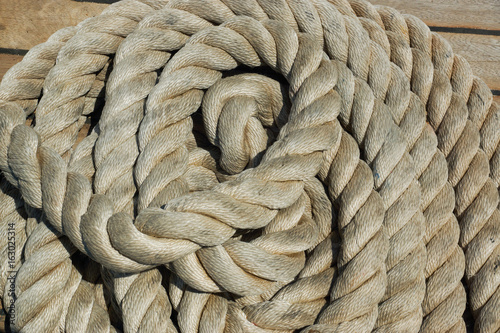 A pile of rope on the deck of a boat