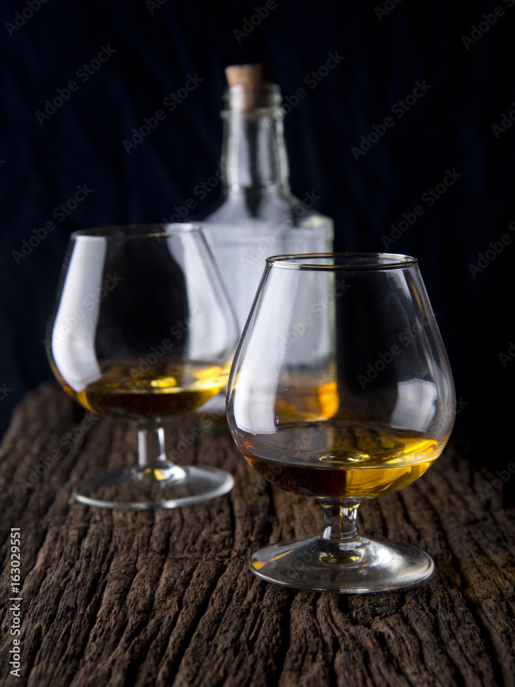 whisky glasses on wood table.