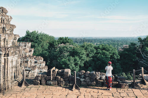 Tourist in Phnom Bakheng temple