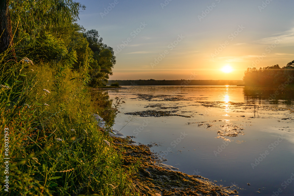Sunset over the Dnieper river in Kiev, Ukraine, during a warm summer evening