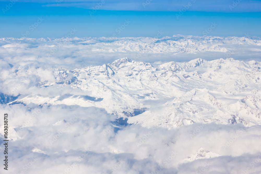 Alps - aerial view from window of airplane Alps - aerial view from window of airplane