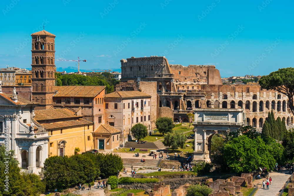 View of Colosseum behind buildings