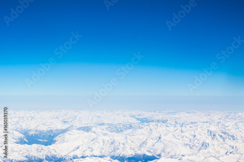 Snow Alps - aerial view from window of airplane
