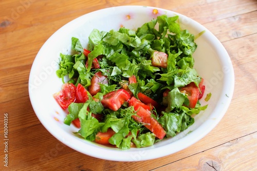 Simple but very tasty salad with tomatoes and herbs.
