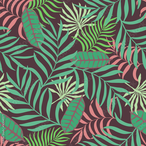 Tropical background with palm leaves. Seamless floral pattern