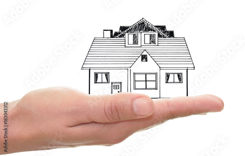 Hand holding house drawing