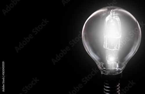 Light bulb on black background