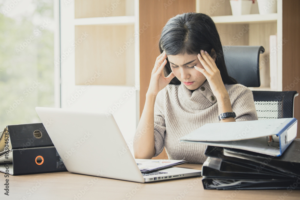 Asian woman working hard and feeling dizzy at office, woman with office syndrome concept, vintage tone. Asian woman working hard and feeling dizzy at office, woman with office syndrome concept, vintage tone.