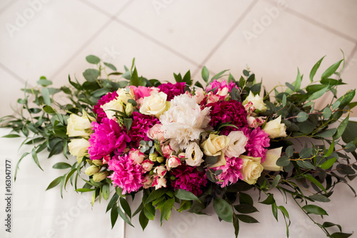 Wedding peony bouquet on table photo