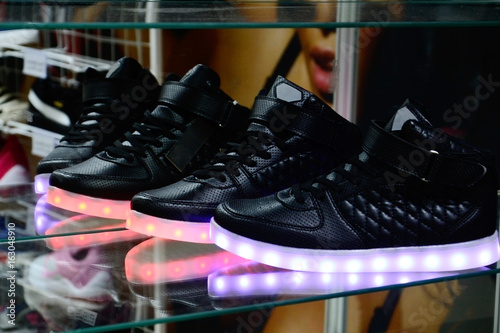 glow running shoes in shop near mirror