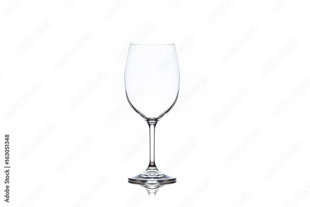One clean empty wine glass on white background One clean empty wine glass on white background