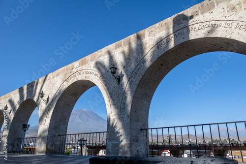 The Arches of Yanahuara Plaza and Misti Volcano on Background - written on the arches are quotes of famous people of the city - Arequipa, Peru photo
