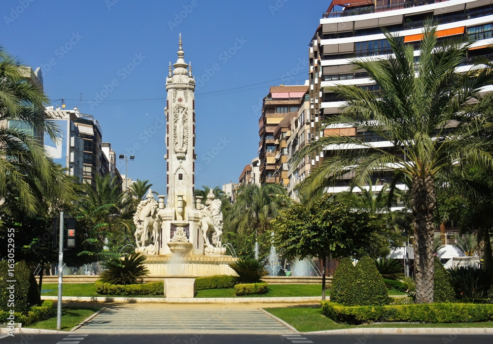 Beautiful square with a fountain and sculptures in Alicante, Spain