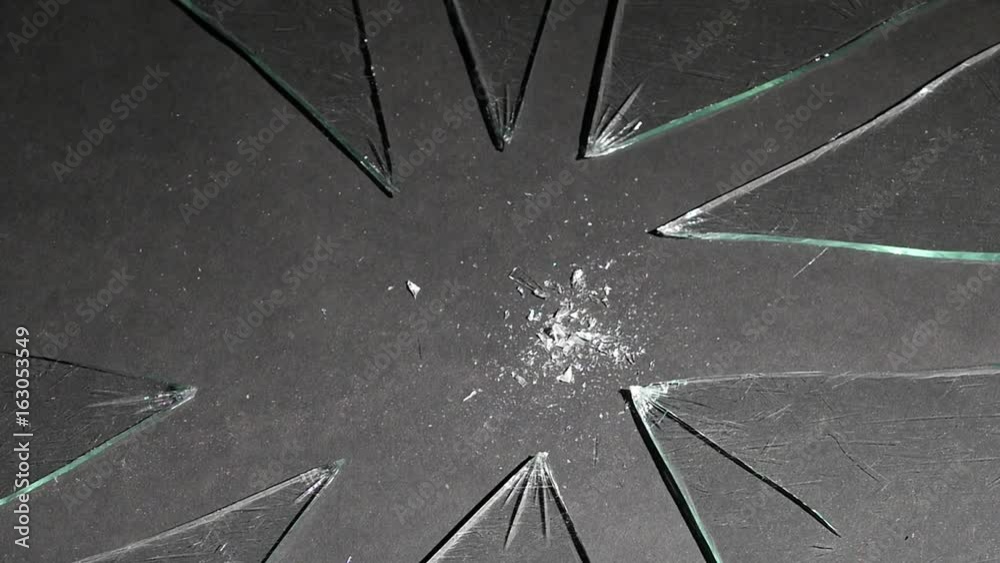 With a light hammer blow, the glass is broken into particles. Slow motion