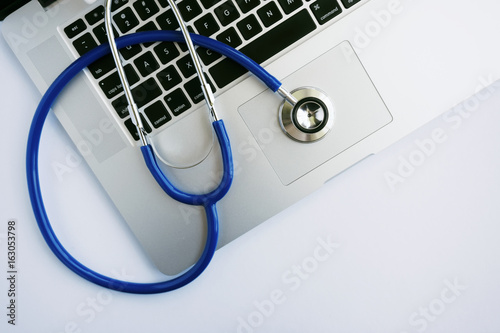 A Laptop Computer with Stethoscope Lying on Top