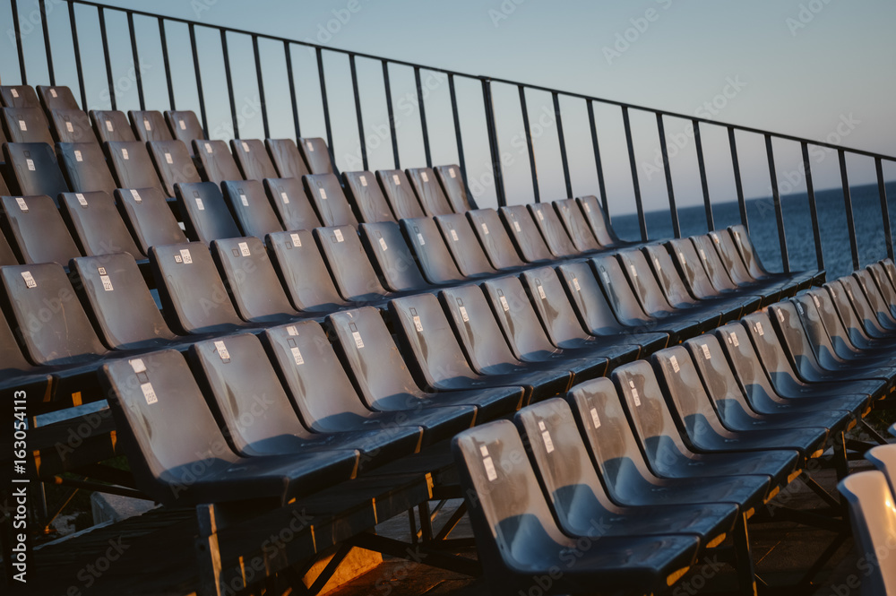 Fototapeta premium Empty seats row ready for visitors abstract event pattern background