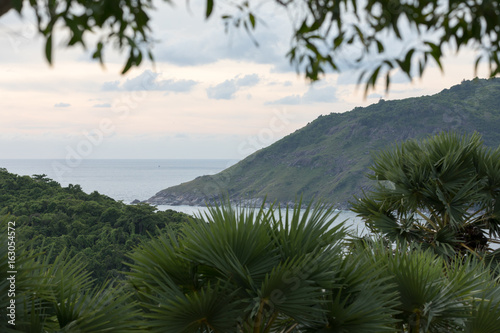 Landscape at sunset - the sea and green hills