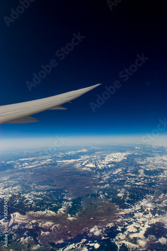 airplane wing above earth