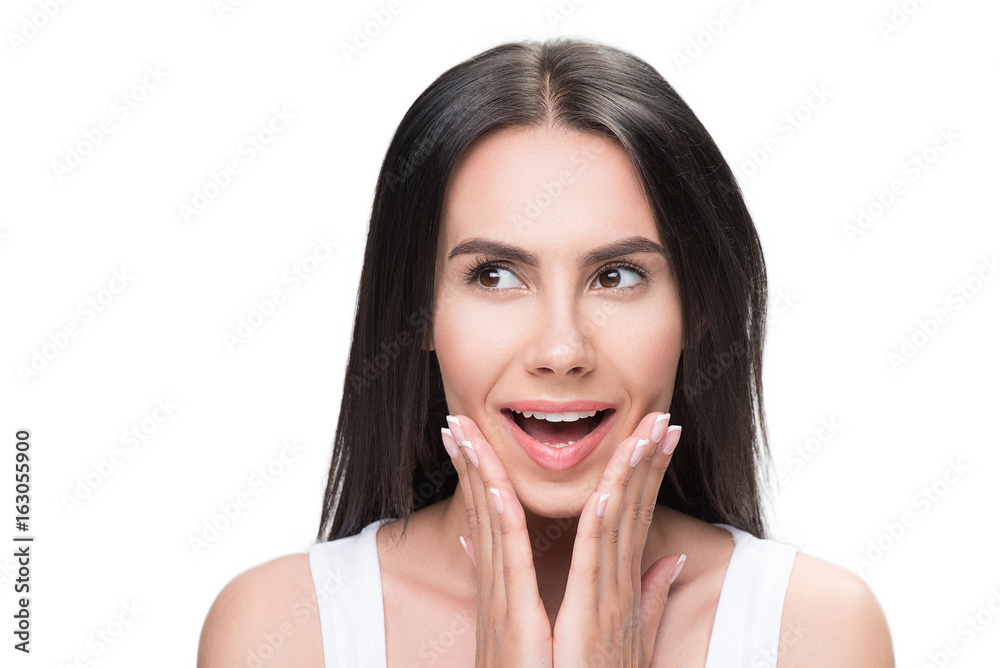 Joyful woman is satisfied with her facial skin Joyful woman is satisfied with her facial skin