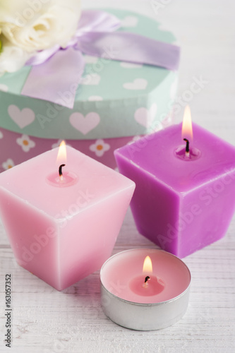 Arrangement of candles  flowers  pastel gift box