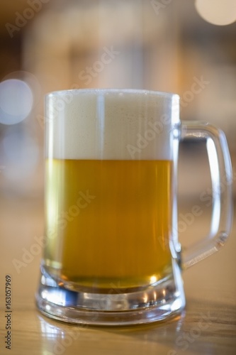 Close-up of beer mug on table