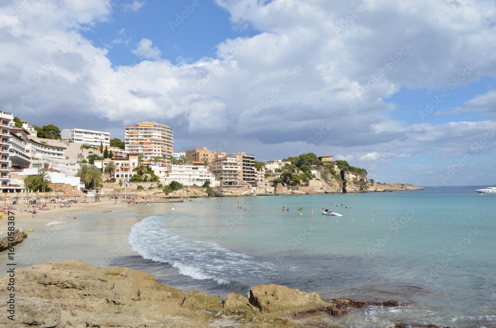 Tourists on the Water of Cala Mayor Beach in Palma de Mallorca, Spain