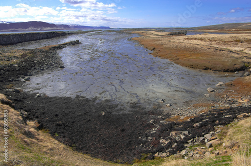 Fjord at Low Tide: The shallow bottom at the end of an Icelandic fjord is visible between tides.