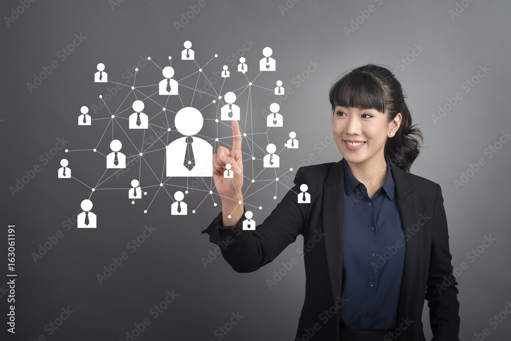 Beautiful Business Woman touching human connect sign on virtual screen Beautiful Business Woman touching human connect sign on virtual screen