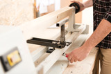 Carpenter is regulating professionally equipment