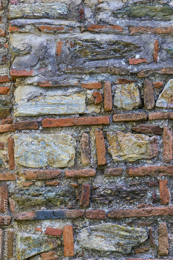 Fototapeta premium Background of an old stone brick wall shot close-up 
