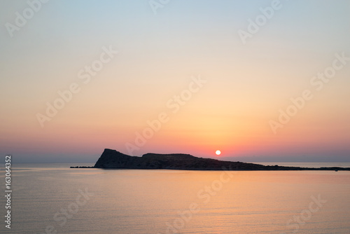 Sunrise on the beach, early morning in Kolokitha island, Crete, Greece