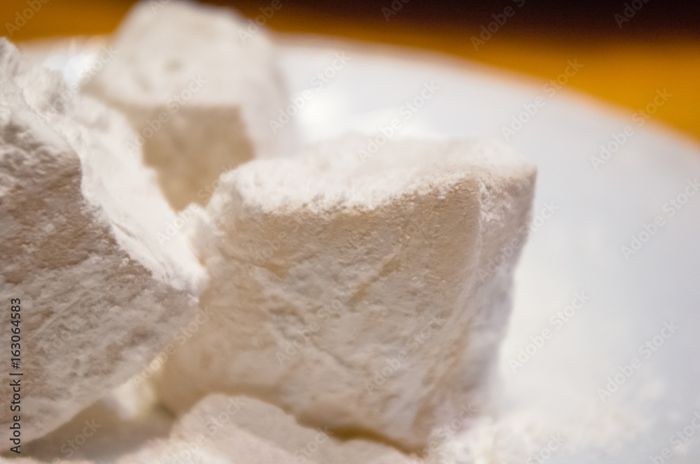 Turkish delight or rahat-lokum on a white saucer Turkish delight or rahat-lokum on a white saucer