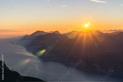 Canvas Print Sunset over the Mountains with Lens Flare