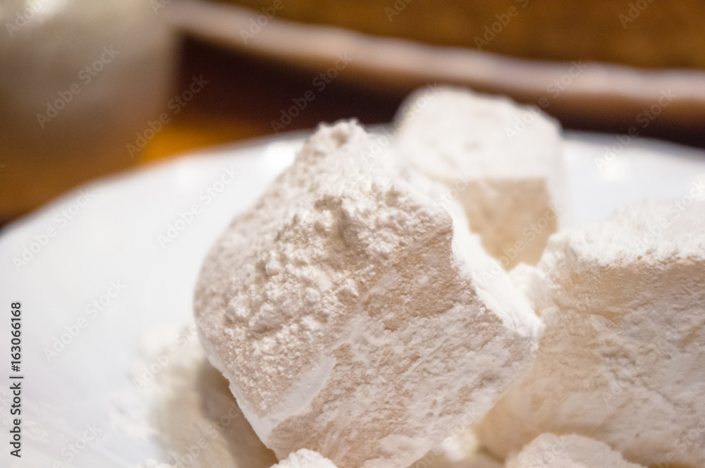 Turkish delight or rahat-lokum on a white saucer Turkish delight or rahat-lokum on a white saucer